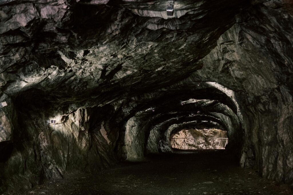 Explore the mysterious rocky tunnel with natural geological formations.
